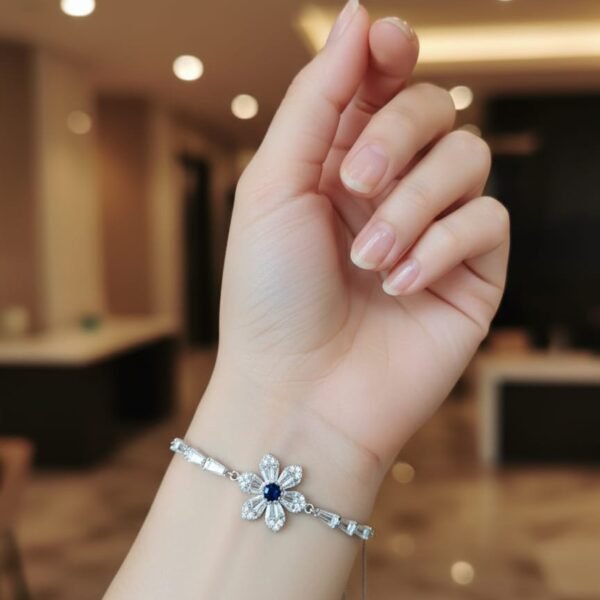 dainty silver floral bracelet – blue sapphire centerpiece with baguette crystals