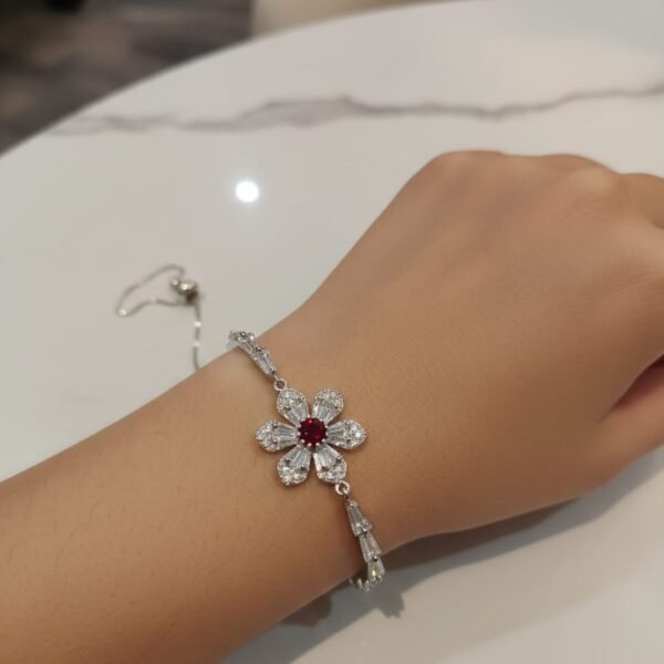 likely gold plated stainless steel or high quality alloy with a polished finish. band style: a hybrid design. the top portion features a brick link pattern (multi link) that transitions into a solid, smooth bangle style cuff at the back. closure: typically features a jewelry style clasp or a hinged spring opening for a seamless "bracelet" look on the wrist.