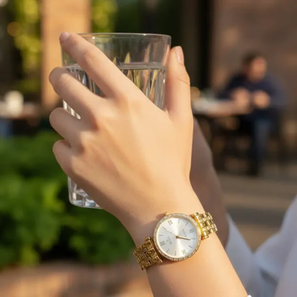 luxury seastar women’s gold bracelet watch – baguette crystal bezel with sunray dial & roman numerals