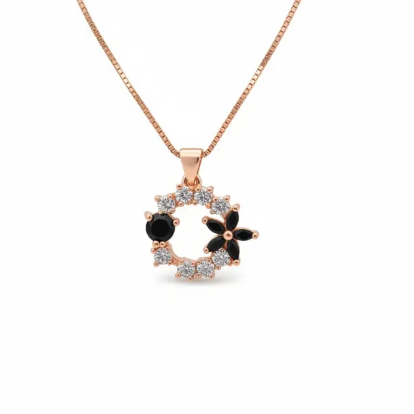 gold tone floral wreath pendant with black onyx accents